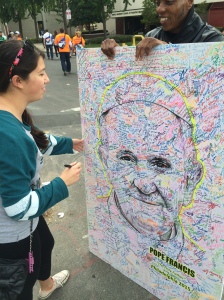 A representative from the National Air and Space Museum in D.C walked around with a portrait of Pope Francis  and encouraged individuals (myself included) to sign it in honor of his visit.